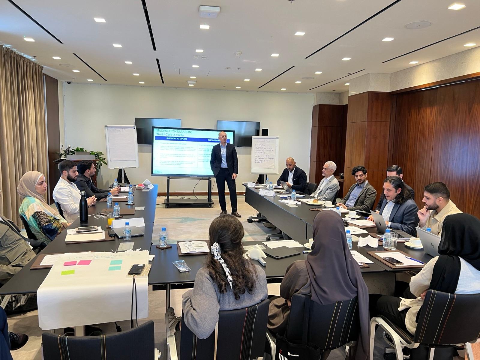 Oussama Mezoui leading a boardroom presentation