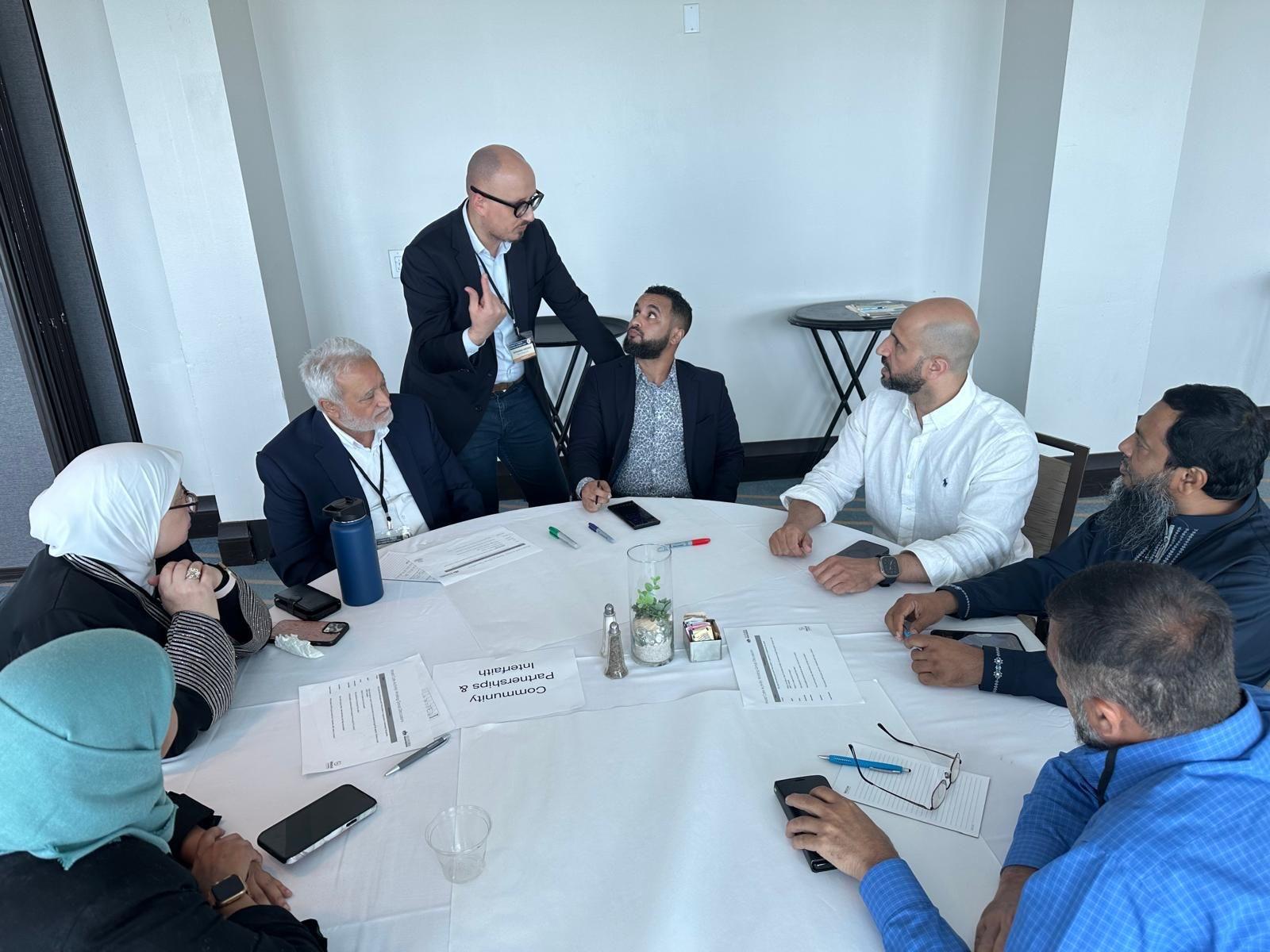 Board members engaged in a round table governance discussion