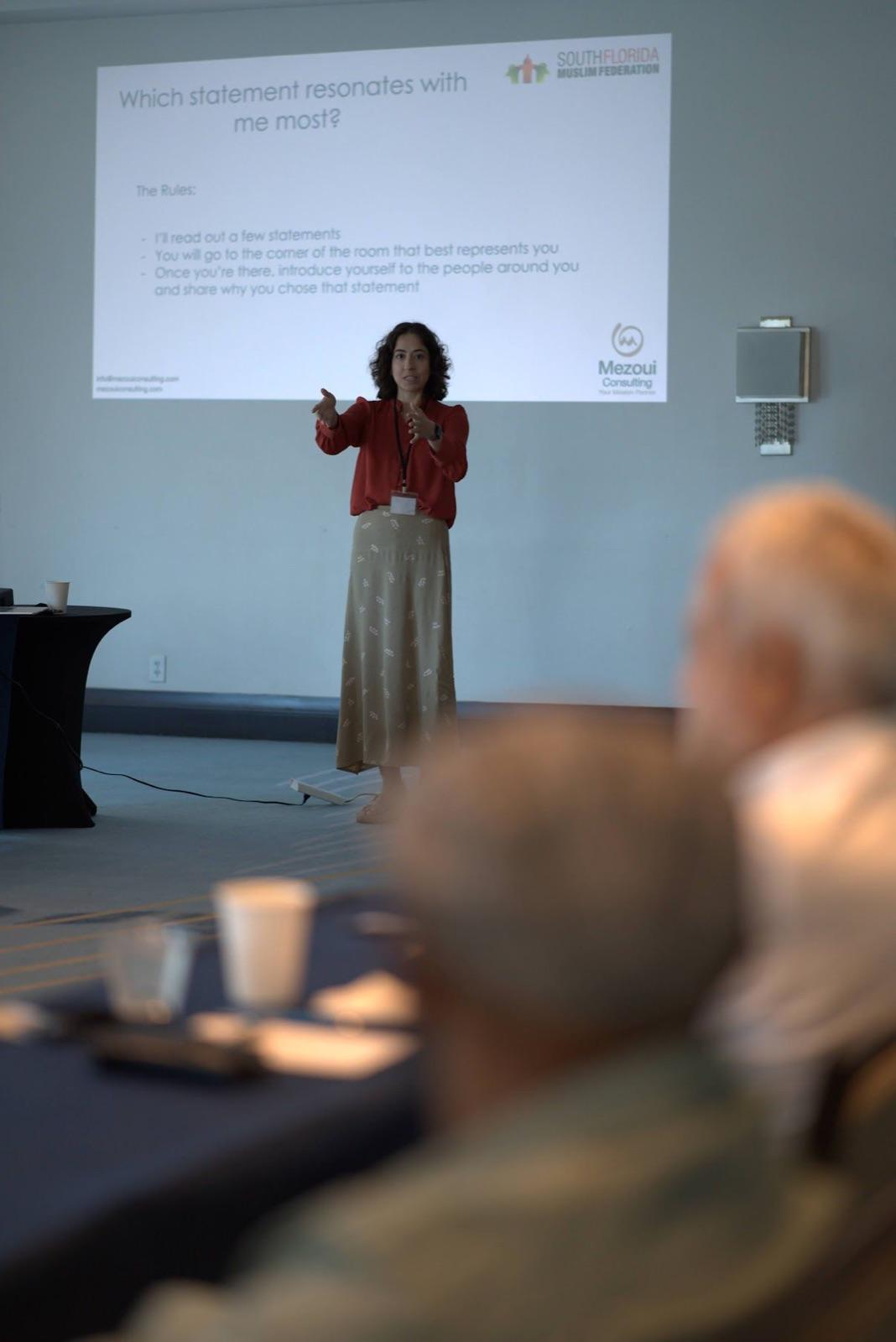 Shafaq Zia presenting executive advisory insights at a conference